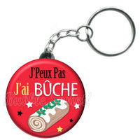 Porte-clés badge J'peux pas j'ai Bûche -Réf PC1083